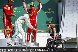 Lewis Hamilton, Mercedes AMG F1, 2nd position, shakes hands with Nathalie McGoin on the podium