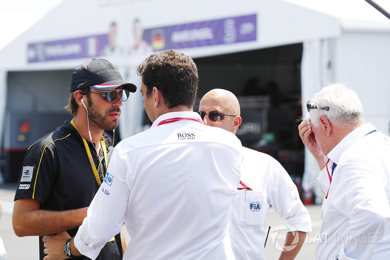 Jean-Eric Vergne, Techeetah, talks with FIA personnel in the pits