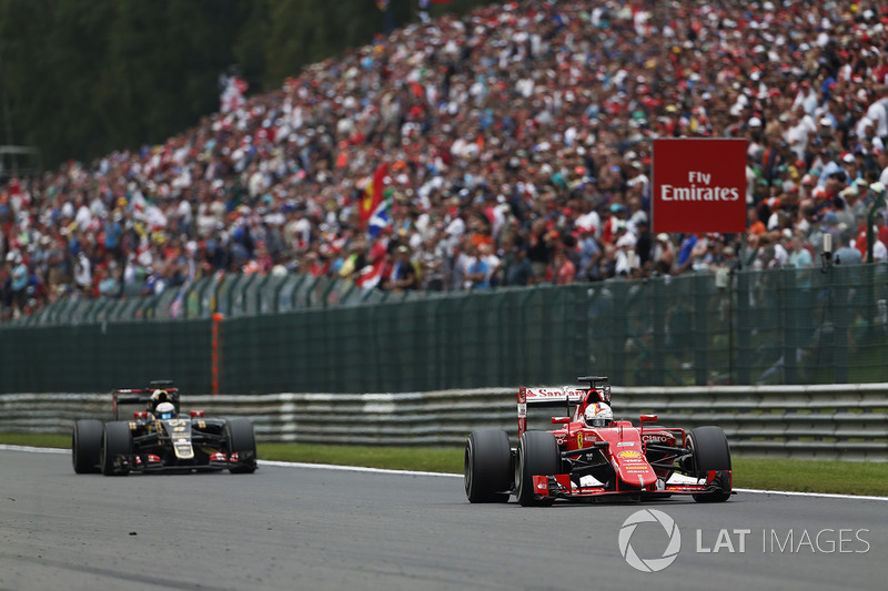 Sebastian Vettel, Ferrari SF-15T, leads Romain Grosjean, Lotus E23 Mercedes