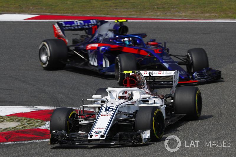 Charles Leclerc, Sauber C37 Ferrari, leads Pierre Gasly, Toro Rosso STR13 Honda