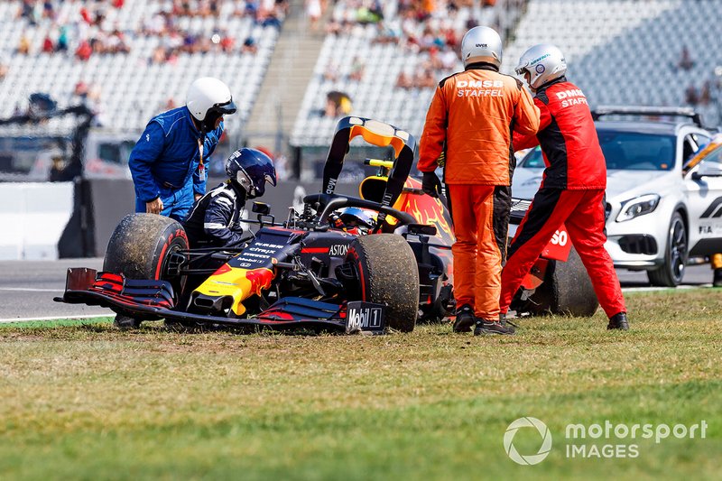 Marshals and doctors assist Pierre Gasly, Red Bull Racing RB15, after a crash