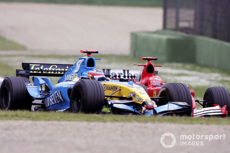 Fernando Alonso, Renault R25, leads Michael Schumacher, Ferrari F2005