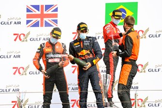 Race Winner Felipe Drugovich, MP Motorsport, Jehan Daruvala, Carlin and Callum Ilott, UNI-Virtuosi celebrate on the podium with the champagne