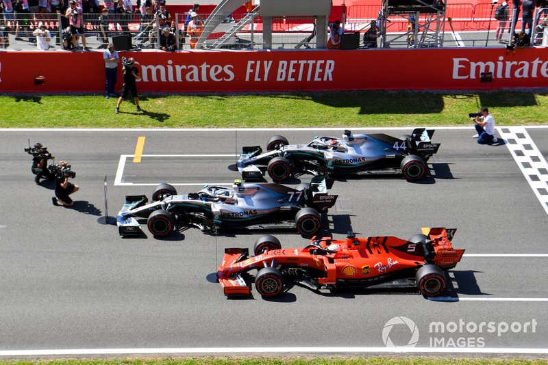 Top three Qualifiers Valtteri Bottas, Mercedes AMG W10, Lewis Hamilton, Mercedes AMG F1 W10, and Sebastian Vettel, Ferrari SF90, park on the grid after Qualifying