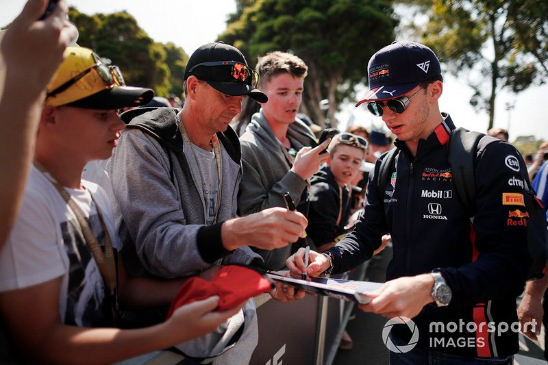 Pierre Gasly, Red Bull Racing, signs autographs for fans