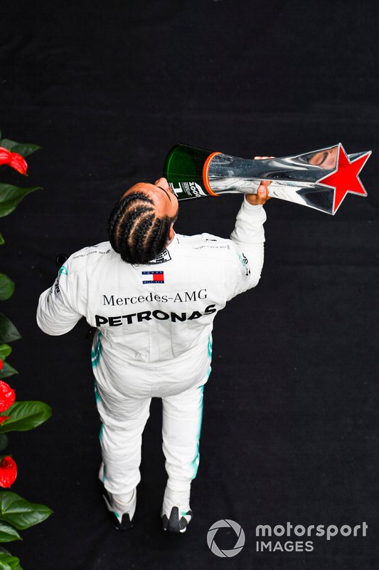 Lewis Hamilton, Mercedes AMG F1, 1st position, with his trophy and Champagne