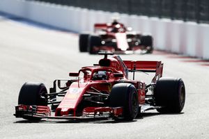 Sebastian Vettel, Ferrari SF71H, leads Kimi Raikkonen, Ferrari SF71H