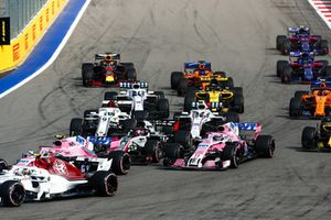 Charles Leclerc, Sauber C37, leads Esteban Ocon, Racing Point Force India VJM11, Romain Grosjean, Haas F1 Team VF-18, Sergio Perez, Racing Point Force India VJM11, Marcus Ericsson, Sauber C37, and the remainder of the field at the start of the race