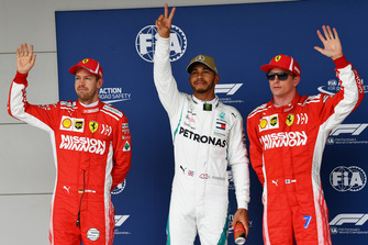 Polesitter Lewis Hamilton, Mercedes AMG F1, second place Sebastian Vettel, Ferrari, third place Kimi Raikkonen, Ferrari,