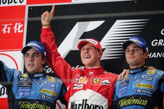 Podium: second place Fernando Alonso, Renault F1 Team, Race winner Michael Schumacher, Ferrari, third place Giancarlo Fisichella, Renault F1 Team