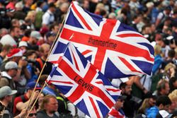 Fans at the podium with flags for Lewis Hamilton, Mercedes AMG F1