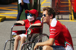 Sebastian Vettel, Ferrari with a young fan