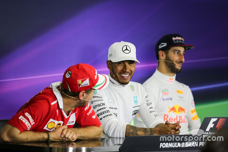 Sebastian Vettel, Ferrari, Lewis Hamilton, Mercedes AMG F1 and Daniel Ricciardo, Red Bull Racing in 