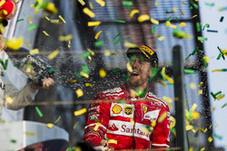 Sebastian Vettel, Ferrari, 1st Position, sprays Champagne on the podium