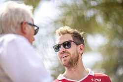 Charlie Whiting, Race Director, FIA, talks with Sebastian Vettel, Ferrari