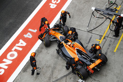 Stoffel Vandoorne, McLaren MCL32, is pushed back in to his garage and retirement from the race