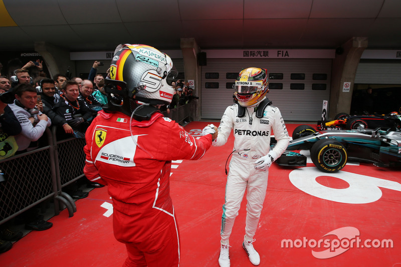 Sebastian Vettel, Ferrari congratulates Lewis Hamilton, Mercedes AMG, in parc ferme after the race