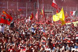 A throng of Ferrari fans invade the circuit after the race