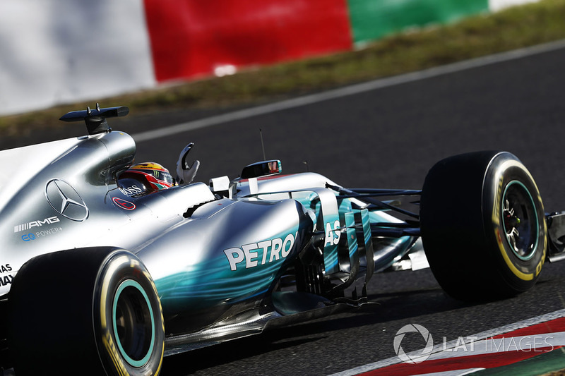 Lewis Hamilton, Mercedes AMG F1 W08, celebrates as he returns to the pits after winning the race