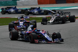 Carlos Sainz Jr., Scuderia Toro Rosso STR12 leads Pierre Gasly, Scuderia Toro Rosso STR12