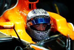 Fernando Alonso, McLaren, in cockpit with helmet visor raised