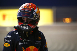 Max Verstappen, Red Bull Racing, climbs out of his car after retiring