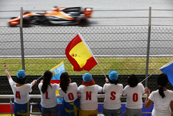 Fernando Alonso, McLaren MCL32, passes by an enthusiastic group of fans