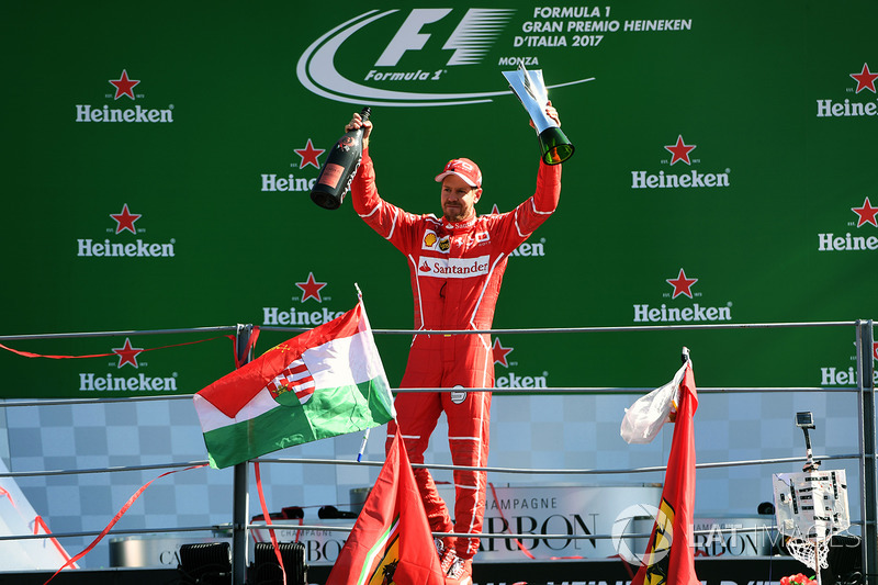 Third place Sebastian Vettel, Ferrari celebrates on the podium