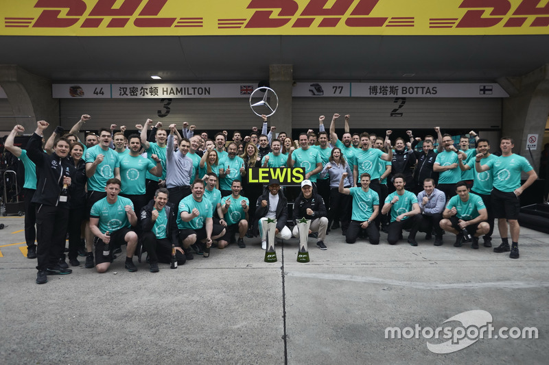 Lewis Hamilton, Mercedes AMG, celebrates victory with Valtteri Bottas, Mercedes AMG and team members