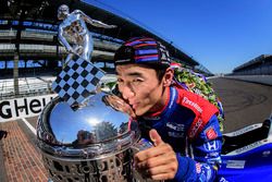 Takuma Sato, Andretti Autosport Honda celebrates his win of the Indy 500 by kissing the Borg-Warner Trophy on the yard of bricks