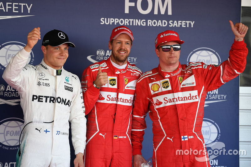 Ganador de la pole Sebastian Vettel, Ferrari, segundo lugar Kimi Raikkonen, Ferrari y el tercero Val