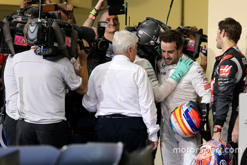 Second place and new world champion Nico Rosberg, Mercedes AMG F1 and Fernando Alonso, McLaren F1