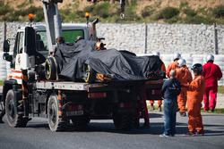 The McLaren MCL32 of Fernando Alonso is recovered back to the pits