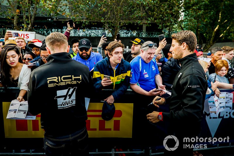 Kevin Magnussen, Haas F1 Team Romain Grosjean, Haas F1 Team sign autographs for fans at the Federation Square event