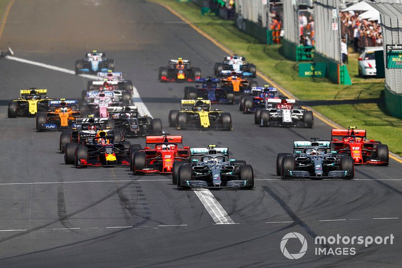 Valtteri Bottas, Mercedes AMG W10, leads Lewis Hamilton, Mercedes AMG F1 W10, Sebastian Vettel, Ferrari SF90, Charles Leclerc, Ferrari SF90, Max Verstappen, Red Bull Racing RB15, and the rest of the field in to the first corner