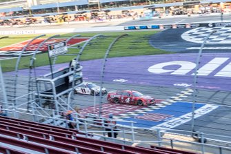 Kevin Harvick, Stewart-Haas Racing, Ford Mustang takes the checkered flag ahead of Denny Hamlin, Joe Gibbs Racing, Toyota Camry