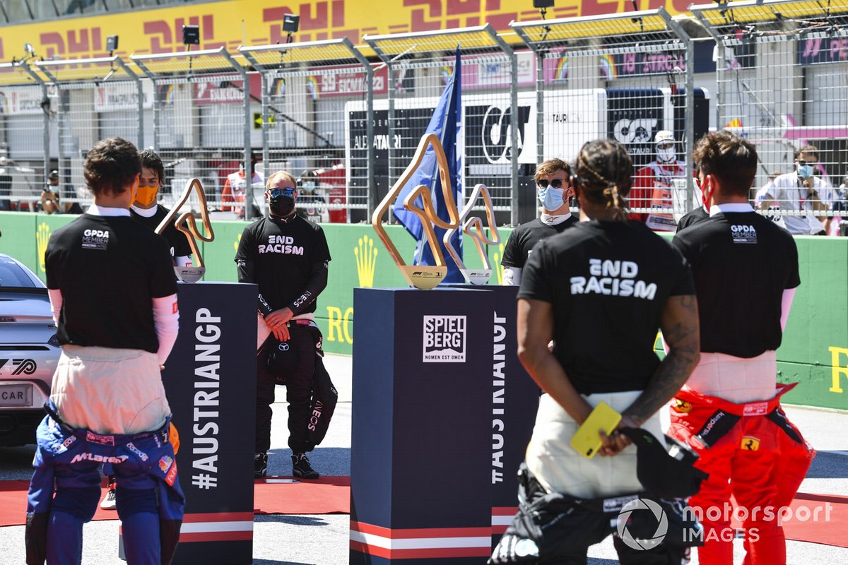 Lando Norris, McLaren, Carlos Sainz Jr., McLaren, Valtteri Bottas, Mercedes-AMG Petronas F1, Lewis Hamilton, Mercedes-AMG Petronas F1, and Charles Leclerc, Ferrari, on the grid prior to the start