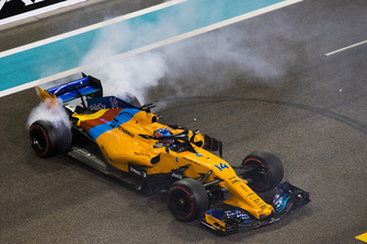 Fernando Alonso, McLaren MCL33, performs donuts on the grid at the end of the race