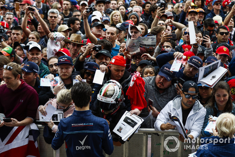 Lance Stroll, Williams Racing, signs autographs for fans