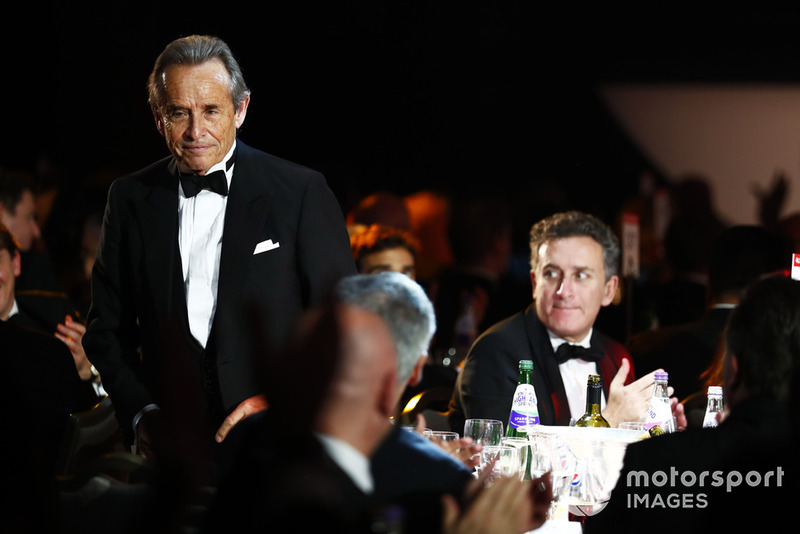 Jacky Ickx heads for the stage to accept a Gregor Grant Award