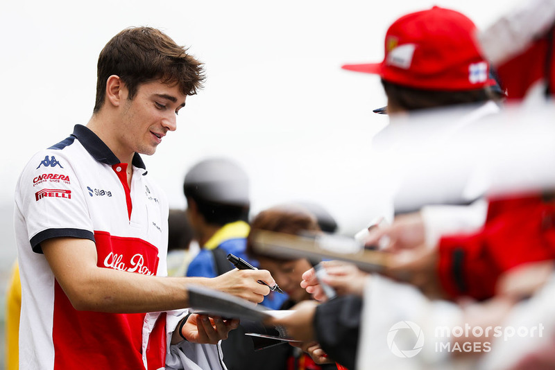 Charles Leclerc, Sauber, signs an autograph