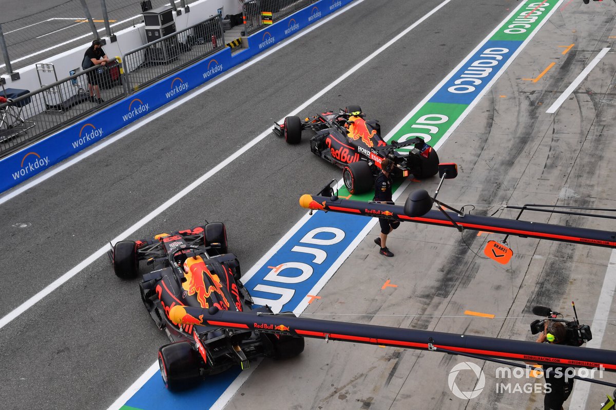 Max Verstappen, Red Bull Racing RB16B, and Sergio Perez, Red Bull Racing RB16B, in the pitlane