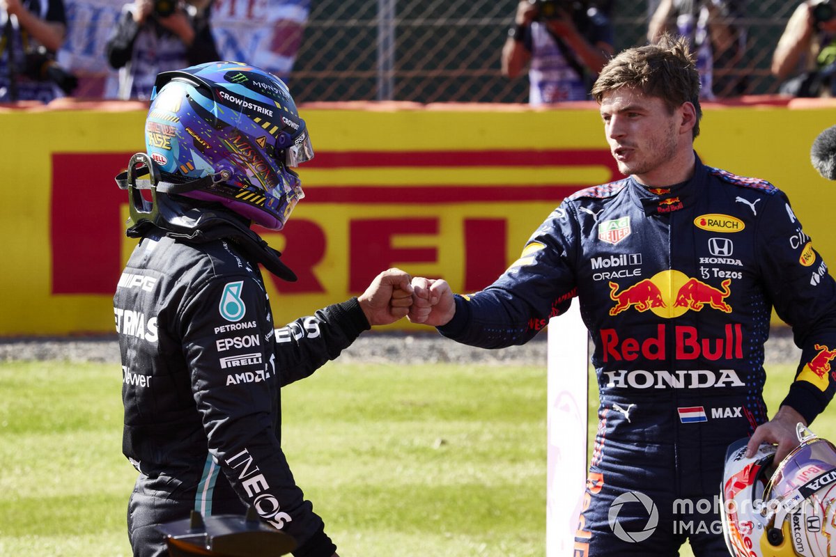 Lewis Hamilton, Mercedes, 2nd position, and Max Verstappen, Red Bull Racing, 1st position, congratulate each other 