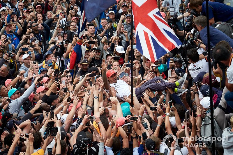 Lewis Hamilton, Mercedes AMG F1, 1st position, celebrates by crowd surfing over his fans