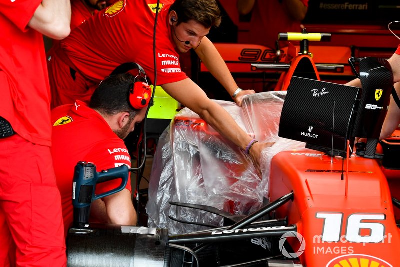 Ferrari mechanics work on their car