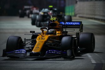 Lando Norris, McLaren MCL34, leads Kevin Magnussen, Haas F1 Team VF-19