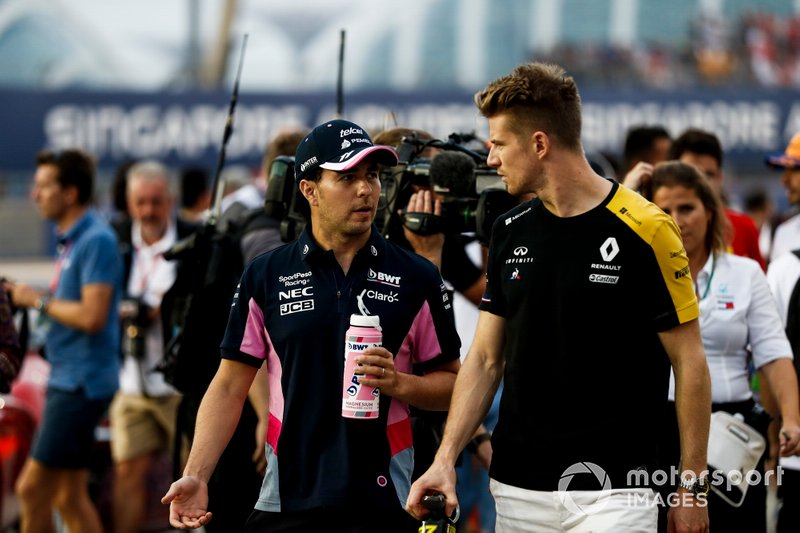 Sergio Perez, Racing Point, talks with Nico Hulkenberg, Renault F1 Team