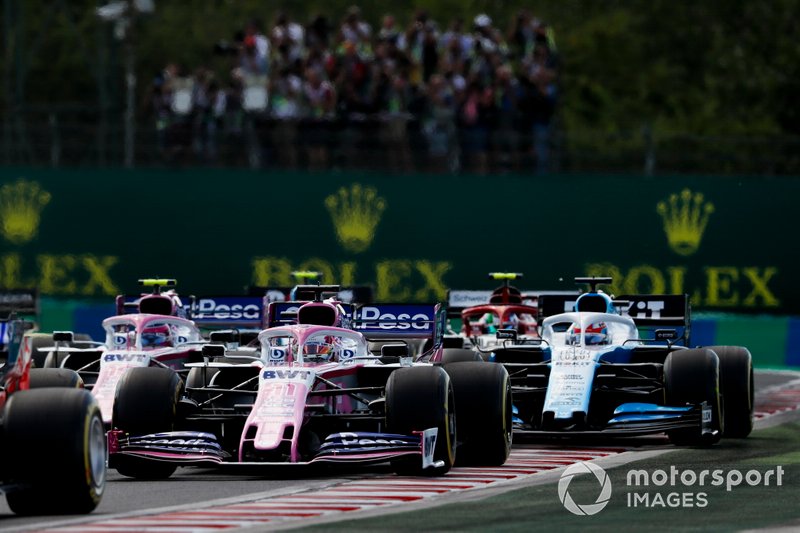 Sergio Perez, Racing Point, leads Lance Stroll, Racing Point, George Russell, Williams Racing, Antonio Giovinazzi, Alfa Romeo Racing, and the remainder of the field 