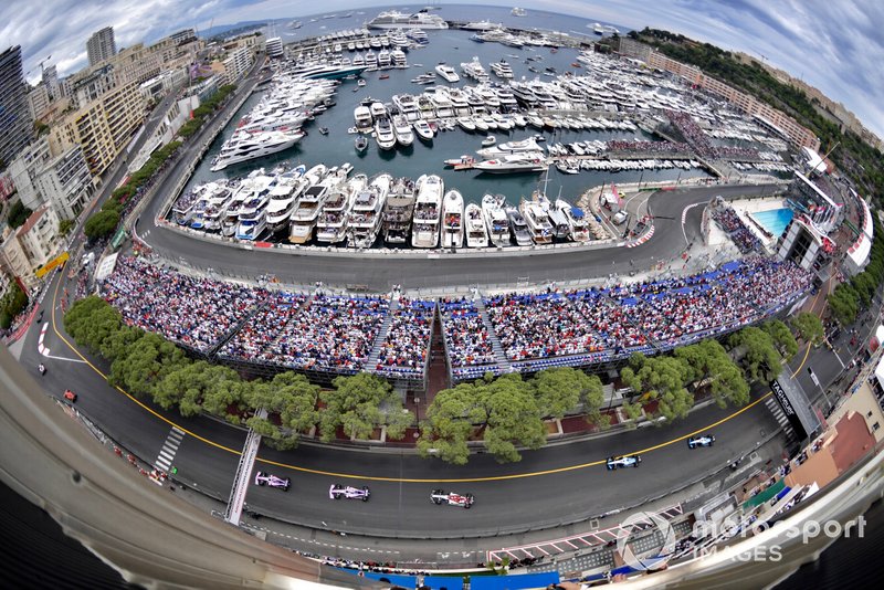 Lance Stroll, Racing Point RP19, leads Sergio Perez, Racing Point RP19, and Kimi Raikkonen, Alfa Romeo Racing C38