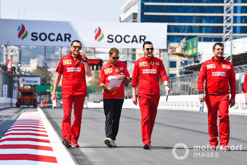 Sebastian Vettel, Ferrari walks the track with his engineers